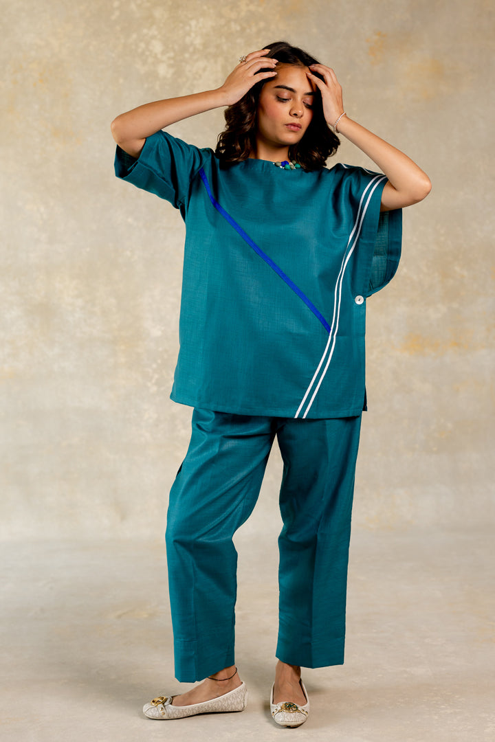 Teal poncho-like co-ord with line abstract