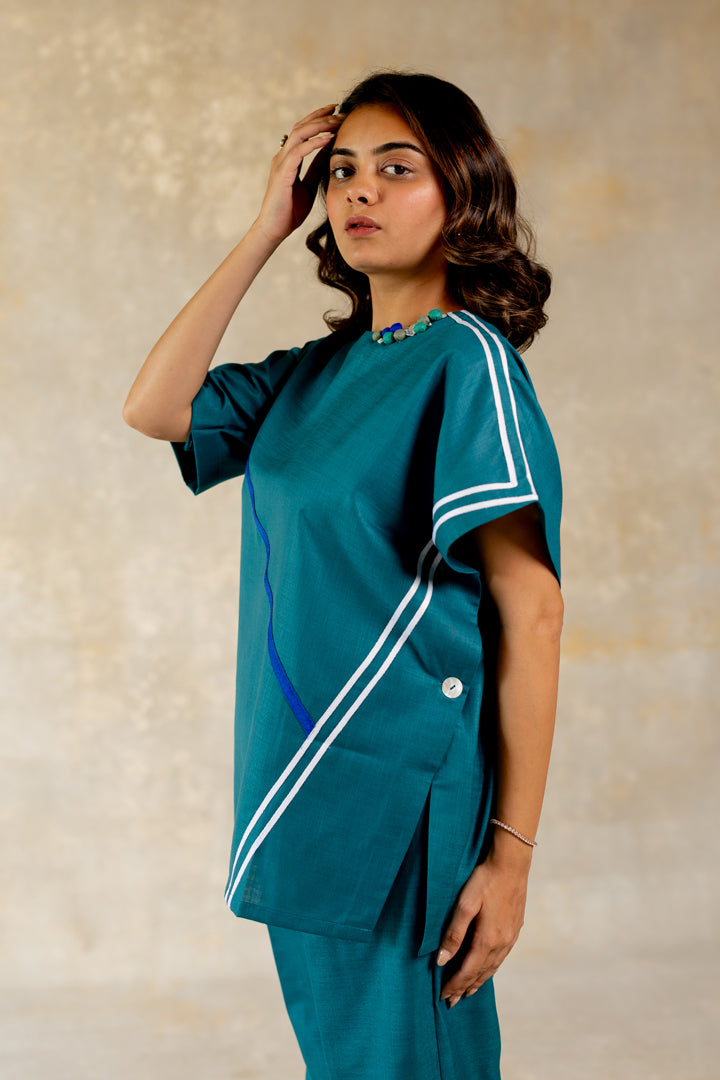 Teal poncho-like co-ord with line abstract