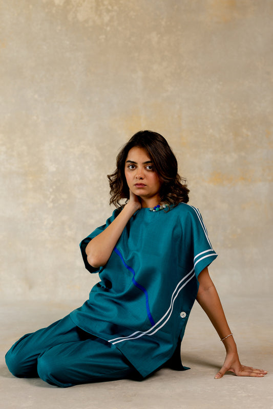 Teal poncho-like co-ord with line abstract
