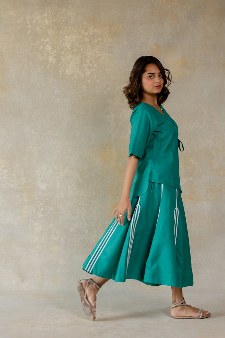 Teal knot dress with line abstract