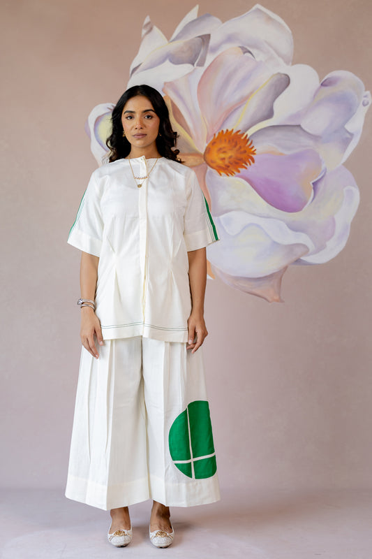 White co-ord with wide-leg pants and shape abstract