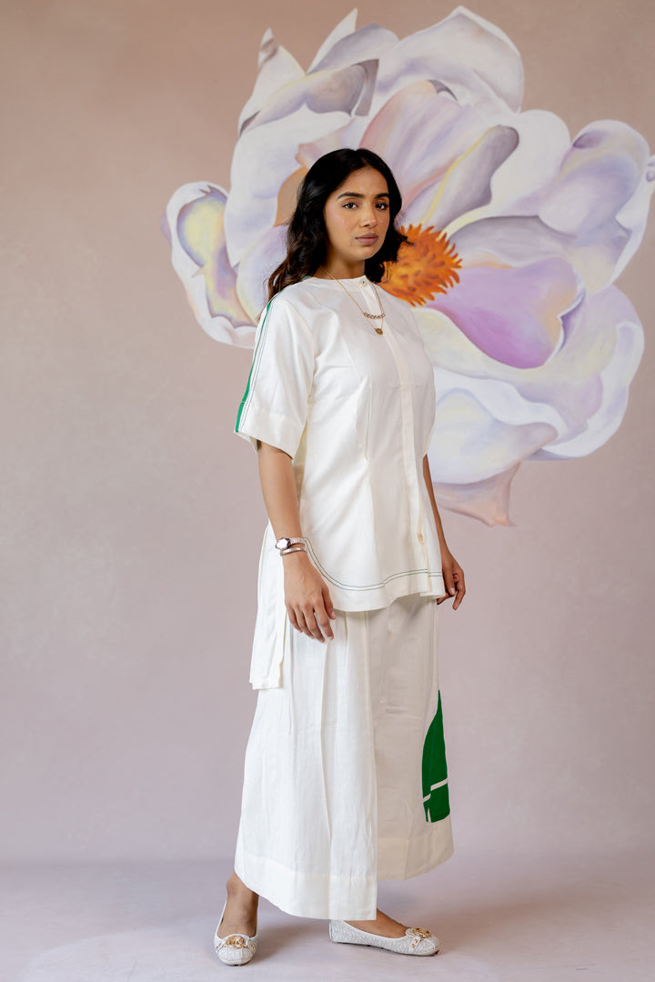 White co-ord with wide-leg pants and shape abstract