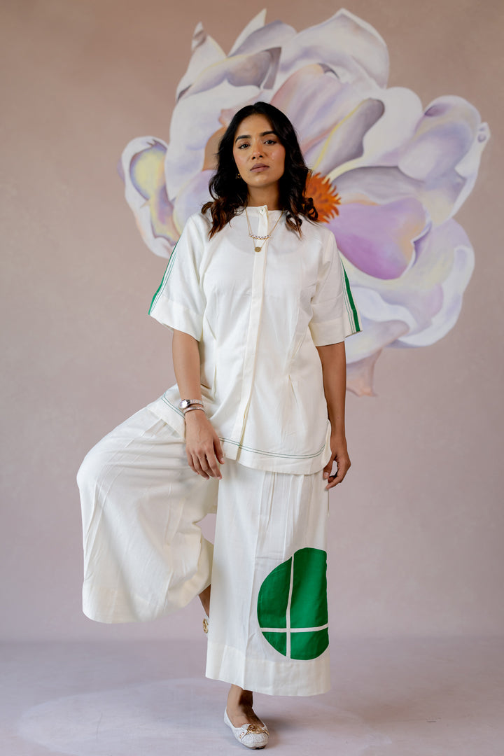 White co-ord with wide-leg pants and shape abstract