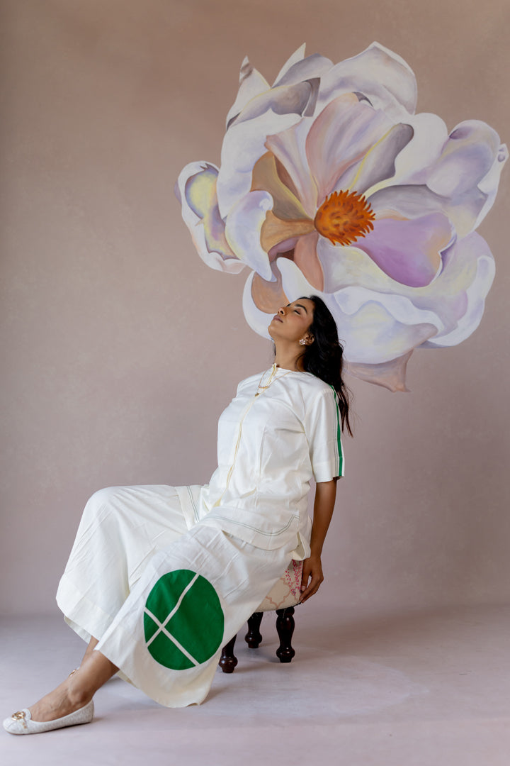 White co-ord with wide-leg pants and shape abstract